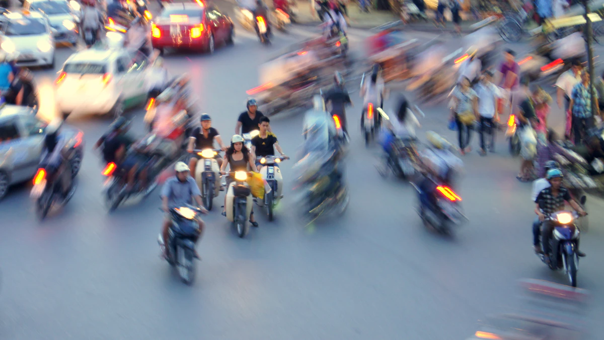 Hanoi street traffic showing alternative commute options for workers