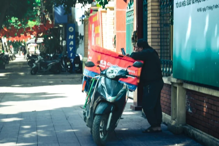 Motorbike rider on an urban street, illustration for student motorbike rental and commuting in Hanoi